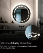 A round bathroom mirror, frameless featuring star shaped LED light. The mirror is mounted on a bathroom wall above a sink. Text overlaid on the image reads ‘Glazonoid, Reflection of Quality, Guaranteed’