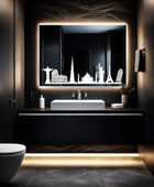 A bathroom vanity with a large rectangular LED mirror mounted on the wall. Behind the mirror is a black and white silhouette of a city skyline. A single sink with a chrome faucet sits below the mirror.