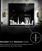 A sleek, rectangular bathroom LED mirror with a modern design. The mirror features a black silhouette of a city skyline etched onto the bottom portion. This mirror would be a perfect touch for any modern bathroom.