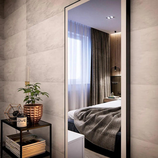 Standing rectangular wall mirror in bedroom