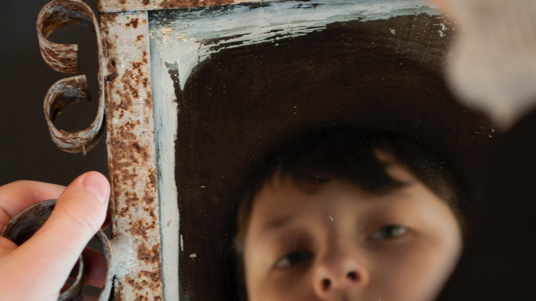 rusted metal frame mirror