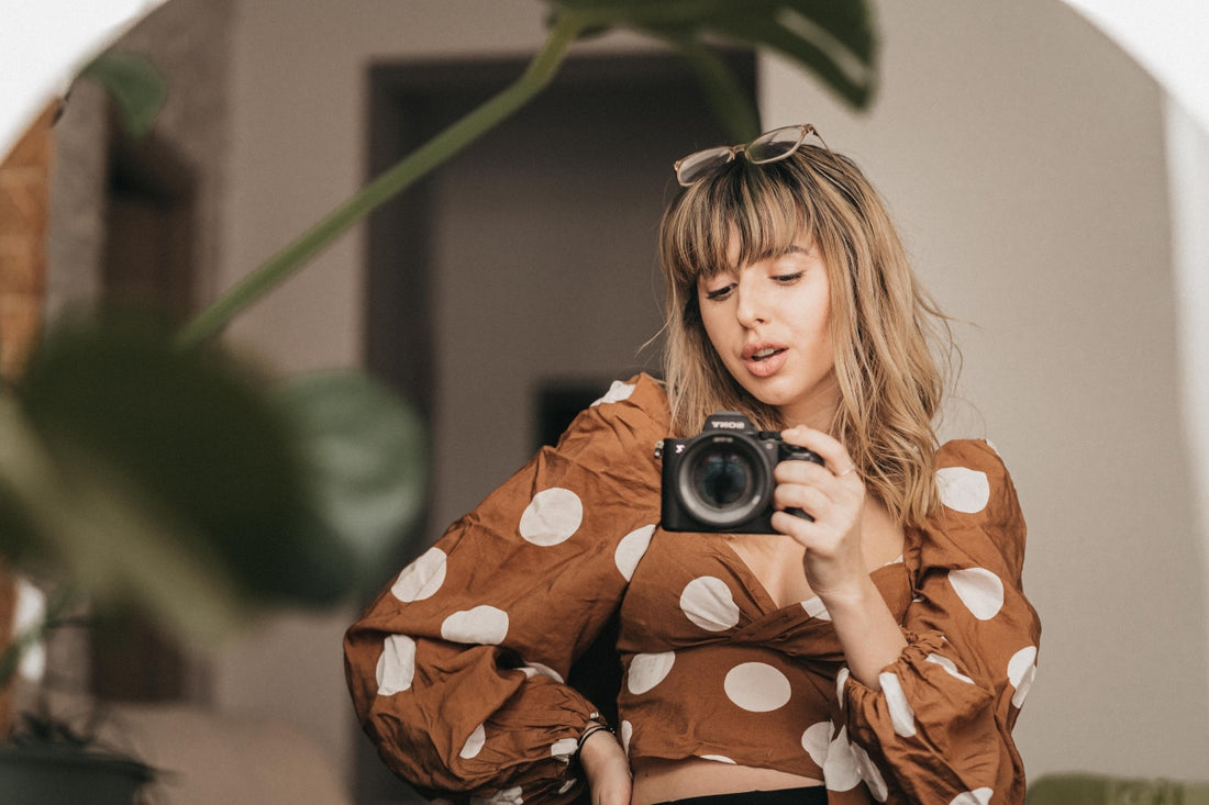 girl taking mirror selfies with camera