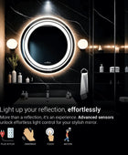 A round, illuminated mirror mounted on a bathroom wall. The mirror has a frameless design and a bright light ring around its circumference. Text overlay reads 