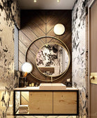Stylish bathroom mirror with a metal frame, the metal frame is made of 2 round rings. Mounted over a wooden countertop with a white sink and some boxes of make up kept over it. 
