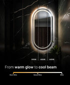 A wall-mounted, oval-shaped bathroom mirror. The mirror has an LED light strip with adjustable color temperature. Below the mirror, there are three color temperature settings: warm white (3000K), natural white (4000K), and cool white (6000K). The text 