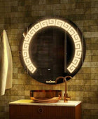 Washbasin Mirror in circular shape above washbasin in dark bathroom