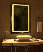 A sleek bathroom vanity featuring a modern vessel sink with a brushed nickel faucet and a rectangular LED mirror with a 2 line design. Next to the sink is a white soap dispenser. This simple and elegant design is perfect for any bathroom. This look is both stylish and functional. 