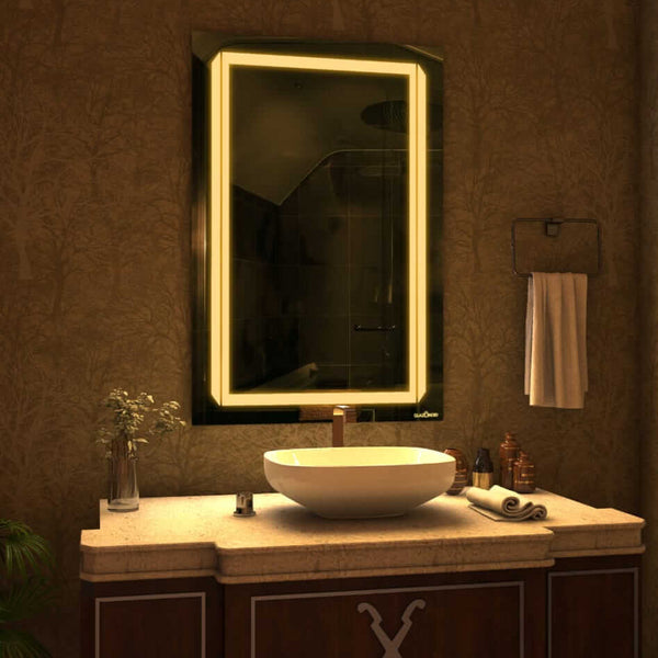 A sleek bathroom vanity featuring a modern vessel sink with a brushed nickel faucet and a rectangular LED mirror with a 2 line design. Next to the sink is a white soap dispenser. This simple and elegant design is perfect for any bathroom. This look is both stylish and functional. 