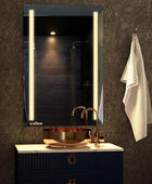 led mirror with white lights over washbasin