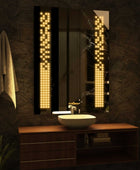Vertical Mirror with warm white LED lights in dark bathroom