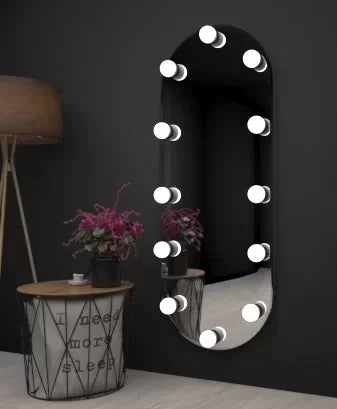 long standing mirror with white lights